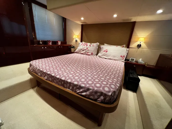  Yacht Photos Pics Luxurious bedroom interior of 2008 Princess 50 yacht with elegant bedding and ambient lighting.