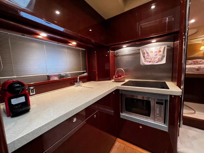  Yacht Photos Pics Luxurious kitchen interior of 2008 Princess 50 yacht with modern appliances and sleek design.
