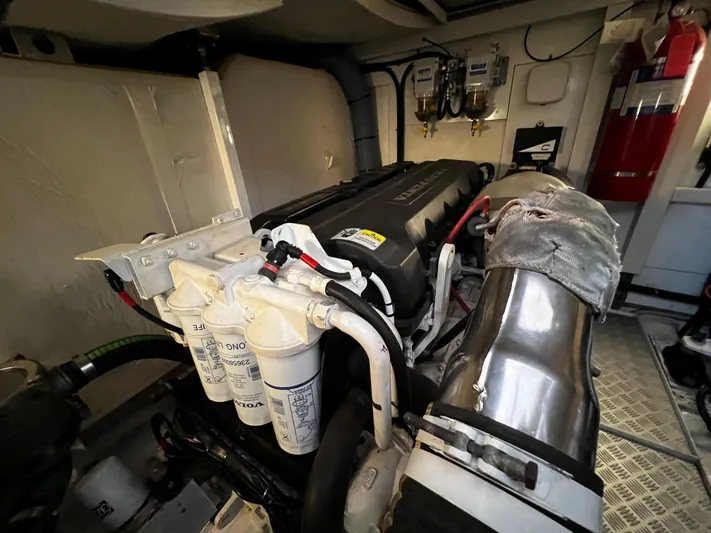  Yacht Photos Pics Engine room of a 2008 Princess 50 yacht, showcasing mechanical components and filters.