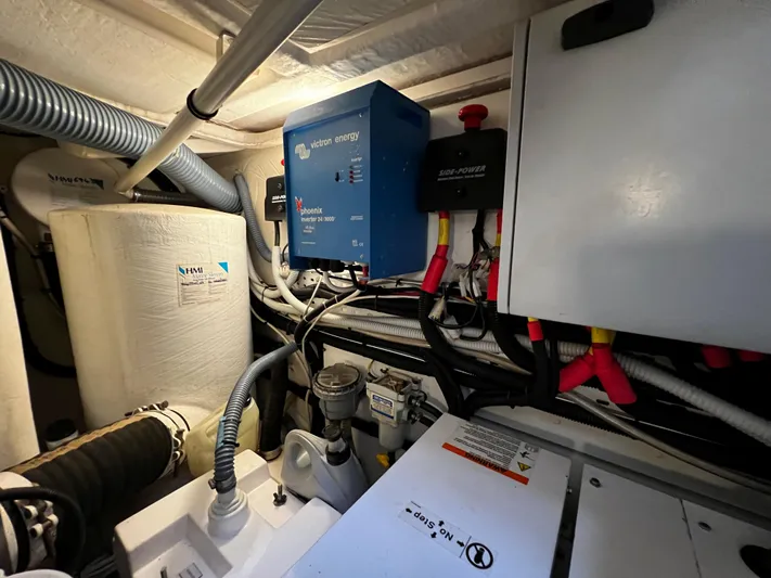  Yacht Photos Pics Engine room of a 2008 Princess 50 yacht with electrical components and wiring.