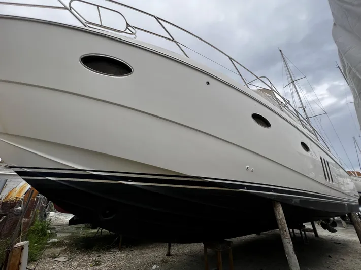  Yacht Photos Pics 2008 Princess 50 yacht on dry dock, showcasing sleek design and elegant structure.