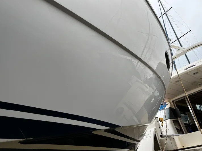  Yacht Photos Pics 2008 Princess 50 yacht, sleek hull design, docked at marina.