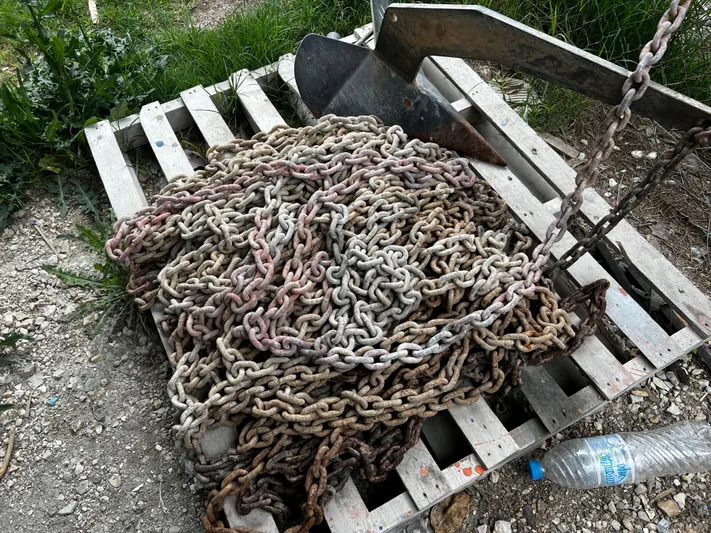  Yacht Photos Pics Rusty anchor chain on wooden pallet, Princess 50, 2008 model.