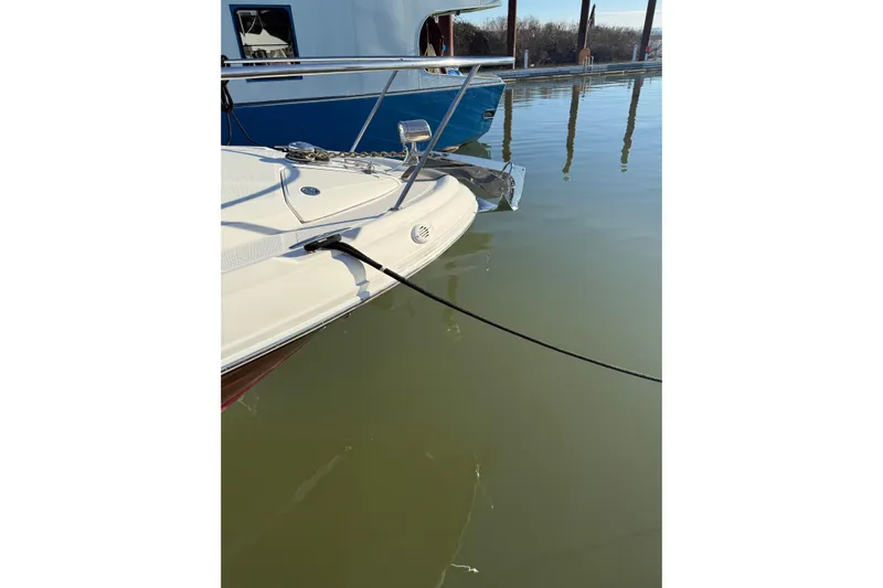  Yacht Photos Pics 2006 Sea Ray 340 Sundancer docked on calm water.