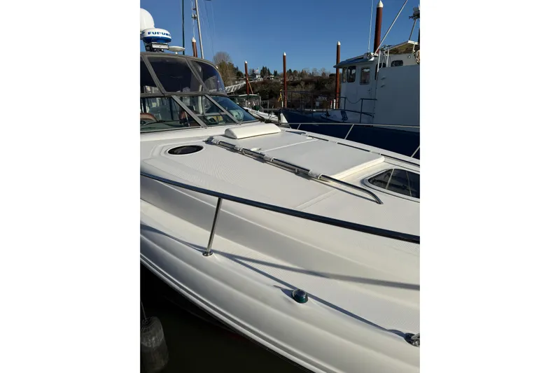  Yacht Photos Pics 2006 Sea Ray 340 Sundancer boat docked, showcasing sleek white exterior and modern design.