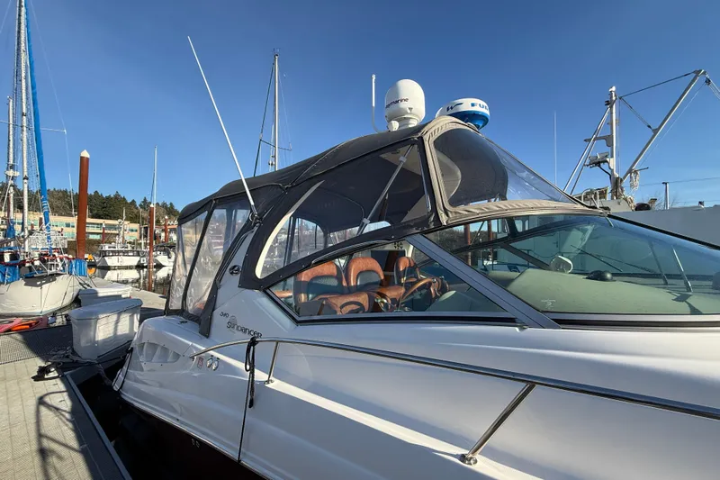  Yacht Photos Pics 2006 Sea Ray 340 Sundancer docked at marina under clear blue sky.