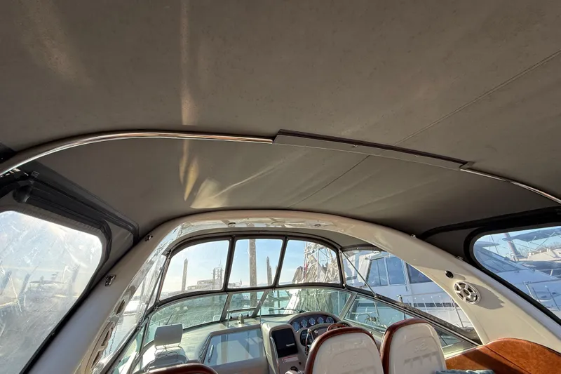  Yacht Photos Pics Interior view of 2006 Sea Ray 340 Sundancer boat cockpit with helm and seating.