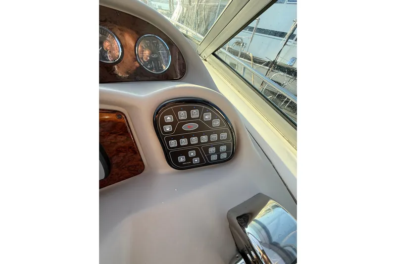  Yacht Photos Pics Control panel of a 2006 Sea Ray 340 Sundancer boat, featuring various switches and gauges.