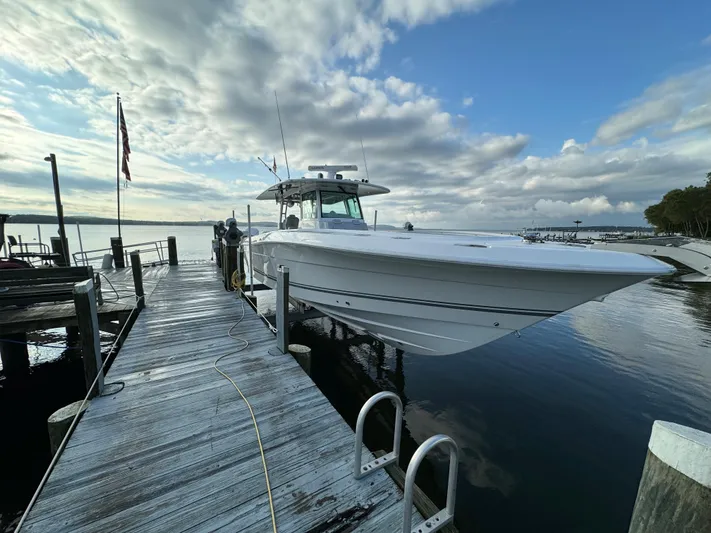  Yacht Photos Pics 2019 HCB Siesta boat docked at a marina under a cloudy sky.