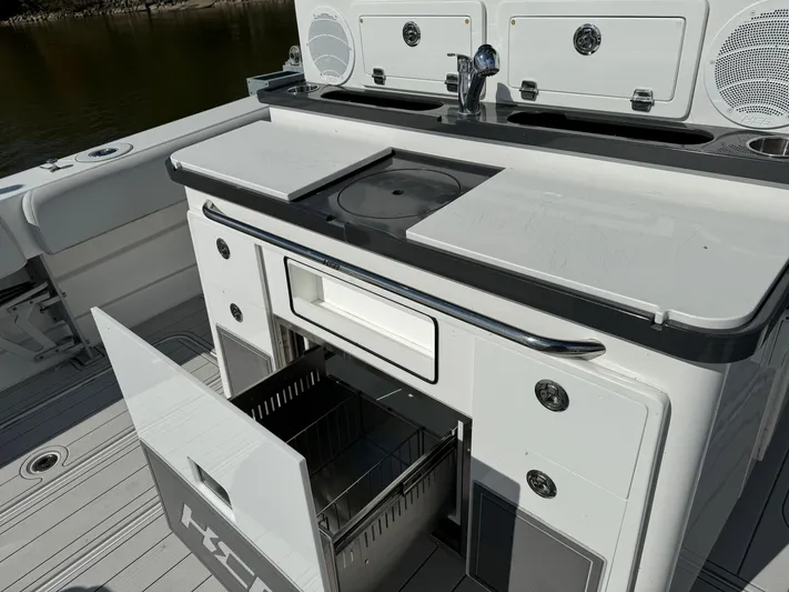  Yacht Photos Pics 2019 HCB Siesta boat kitchen with open storage drawer and sink.