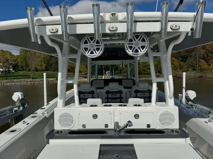  Yacht Photos Pics 2019 HCB Siesta boat with fishing rod holders and seating area.