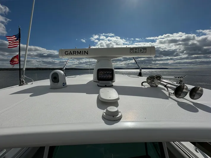  Yacht Photos Pics 2019 HCB Siesta boat with Garmin xHD2 radar on the roof, American flag in the background.
