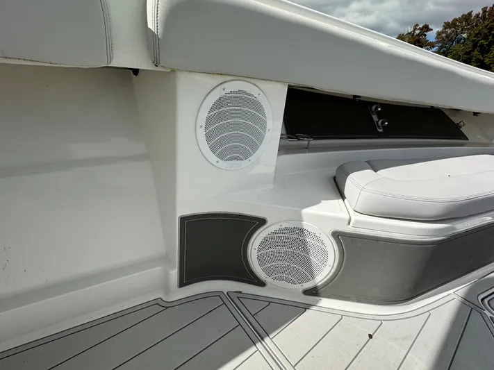  Yacht Photos Pics 2019 HCB Siesta boat interior with white and gray seating and built-in speakers.