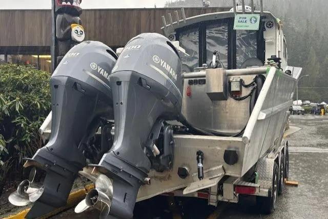 Uno Yacht Photos Pics Custom 2012 Jaxoncraft Hardtop boat with dual Yamaha engines, for sale in rainy setting.