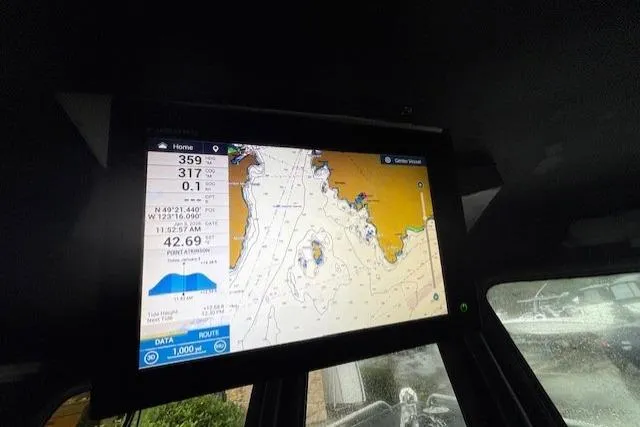 Uno Yacht Photos Pics Navigation screen inside a 2012 Jaxoncraft Custom Hardtop boat, displaying nautical chart and data.