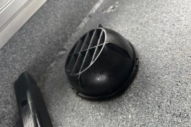 Uno Yacht Photos Pics Black vent on Jaxoncraft Custom Hardtop 2012, textured surface background.