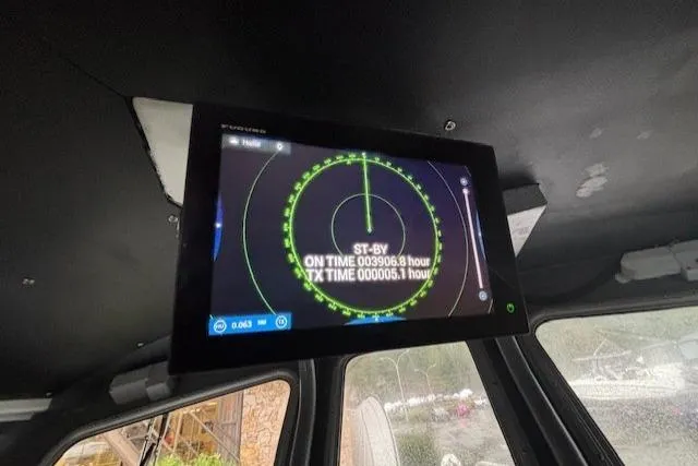 Uno Yacht Photos Pics Custom Jaxoncraft Hardtop 2012 with radar display inside cabin, showing standby and operational time.