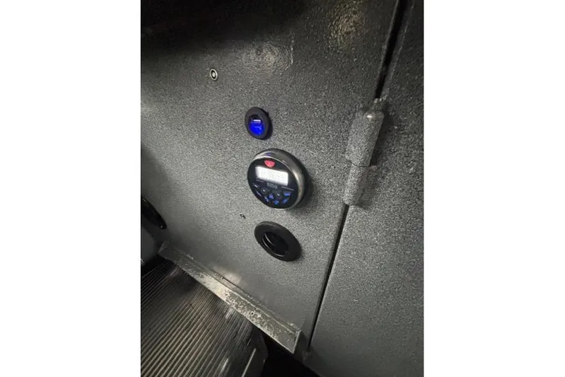 Uno Yacht Photos Pics Control panel inside 2012 Jaxoncraft Custom Hardtop vehicle, featuring digital display and buttons.