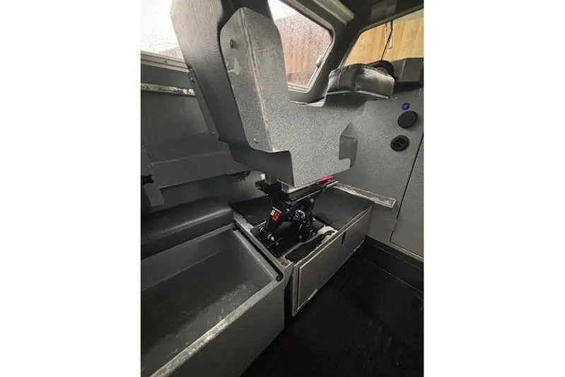 Uno Yacht Photos Pics Interior of 2012 Jaxoncraft Custom Hardtop boat, featuring seating and storage compartments.