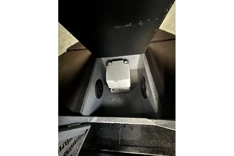 Uno Yacht Photos Pics Interior view of a 2012 Jaxoncraft Custom Hardtop, featuring a compact storage compartment.