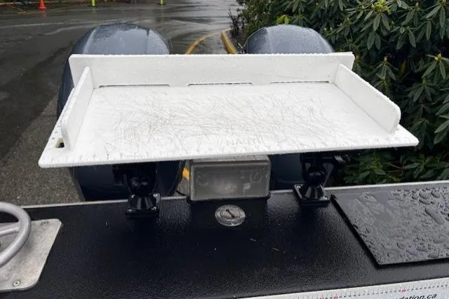 Uno Yacht Photos Pics Custom Jaxoncraft 2012 hardtop boat with a white cutting board on deck.