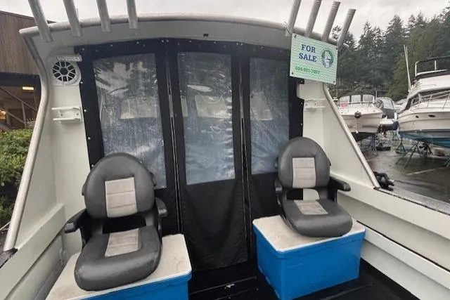 Uno Yacht Photos Pics 2012 Jaxoncraft Custom Hardtop boat interior with two seats, for sale sign visible.