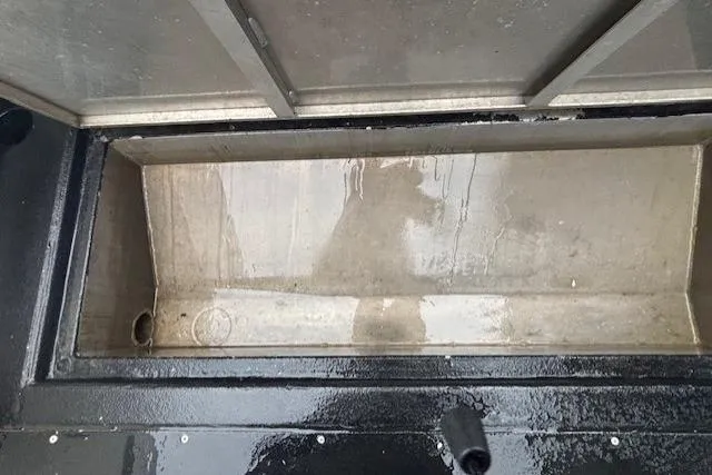 Uno Yacht Photos Pics Open storage compartment of 2012 Jaxoncraft Custom Hardtop boat, showing wet interior.