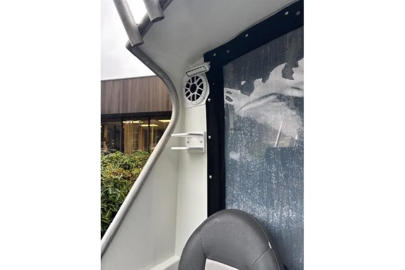 Uno Yacht Photos Pics Interior of 2012 Jaxoncraft Custom Hardtop boat with speaker and window view.