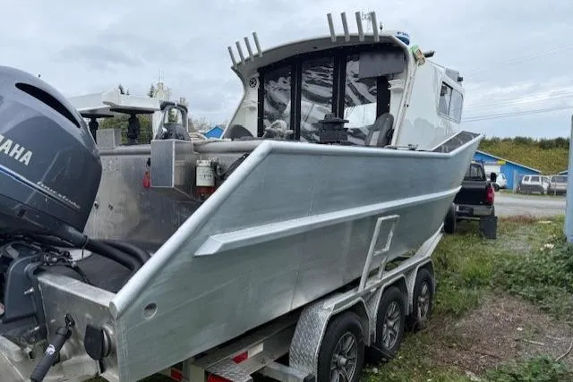 Uno Yacht Photos Pics Custom 2012 Jaxoncraft Hardtop boat on trailer with Yamaha outboard motor, parked outdoors.