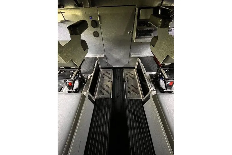 Uno Yacht Photos Pics Interior of 2012 Jaxoncraft Custom Hardtop, featuring metal flooring and storage compartments.