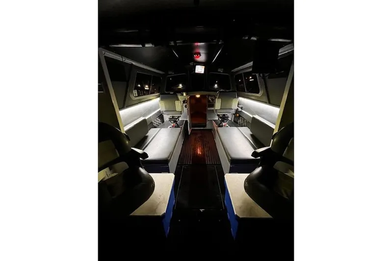 Uno Yacht Photos Pics Interior of 2012 Jaxoncraft Custom Hardtop boat with ambient lighting and seating.