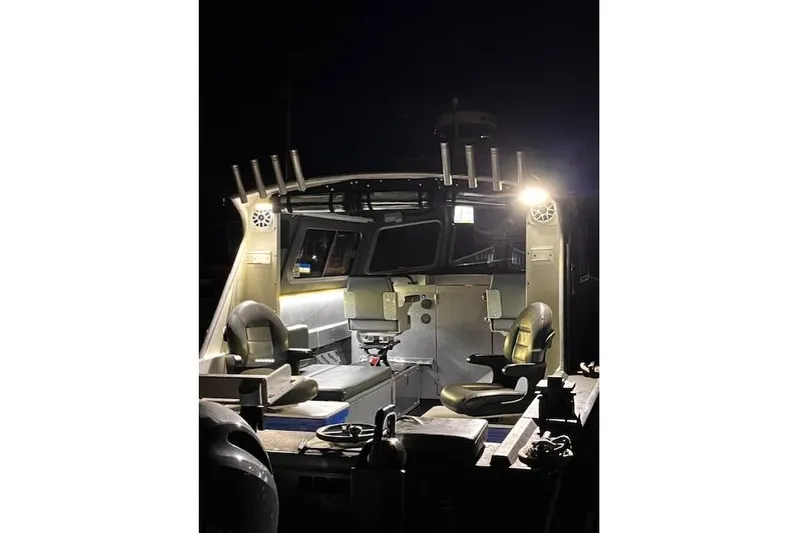 Uno Yacht Photos Pics Custom 2012 Jaxoncraft Hardtop boat interior illuminated at night.