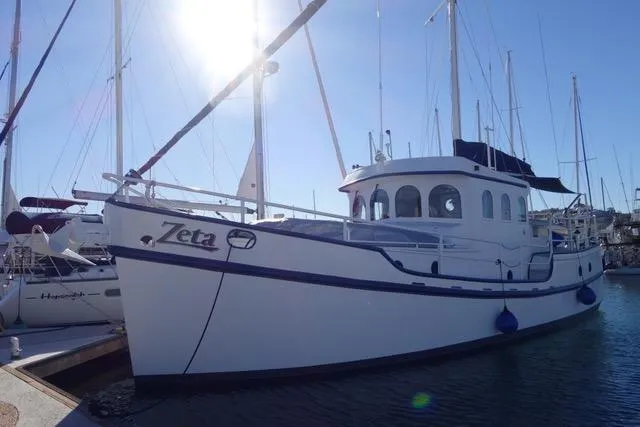 Zeta Yacht Photos Pics Diesel Duck 41-Plus 2009 yacht "Zeta" docked in sunny marina.