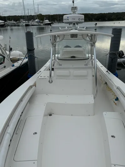  Yacht Photos Pics 2009 Regulator 34SS boat docked in a marina, showcasing spacious deck and sleek design.