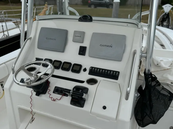  Yacht Photos Pics 2009 Regulator 34SS boat dashboard with Garmin navigation systems and steering wheel.