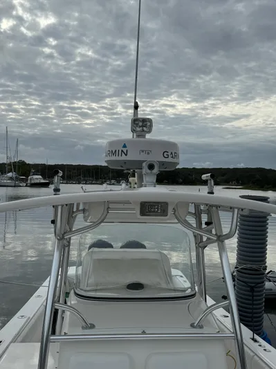  Yacht Photos Pics 2009 Regulator 34SS boat with Garmin radar, docked under cloudy skies.
