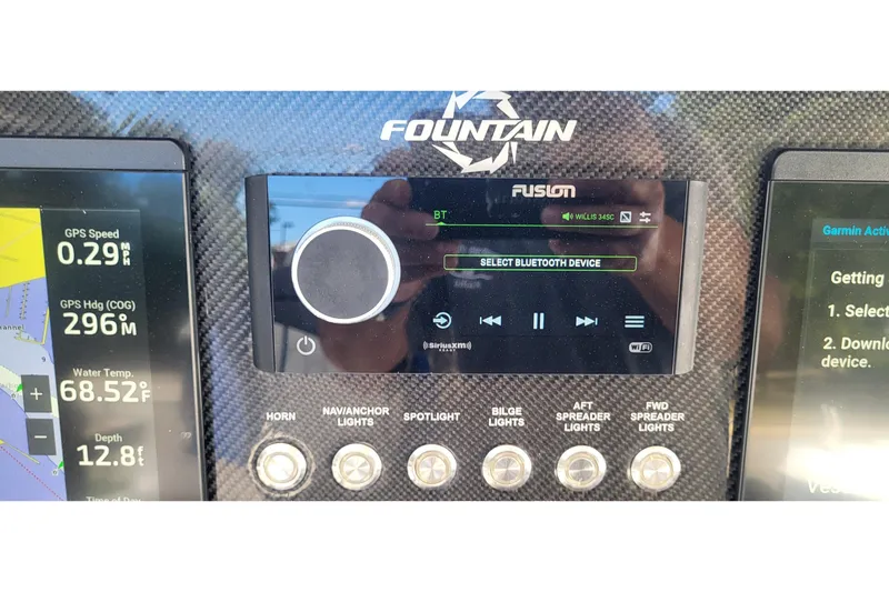  Yacht Photos Pics Dashboard of 2022 Fountain 34 SC boat with GPS and audio controls.