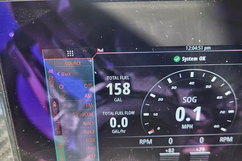  Yacht Photos Pics Dashboard display of a 2022 Fountain 34 SC boat showing fuel and speed data.