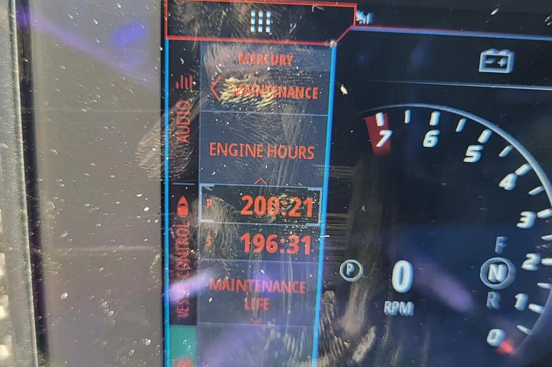  Yacht Photos Pics Dashboard display of 2022 Fountain 34 SC showing engine hours and maintenance life.