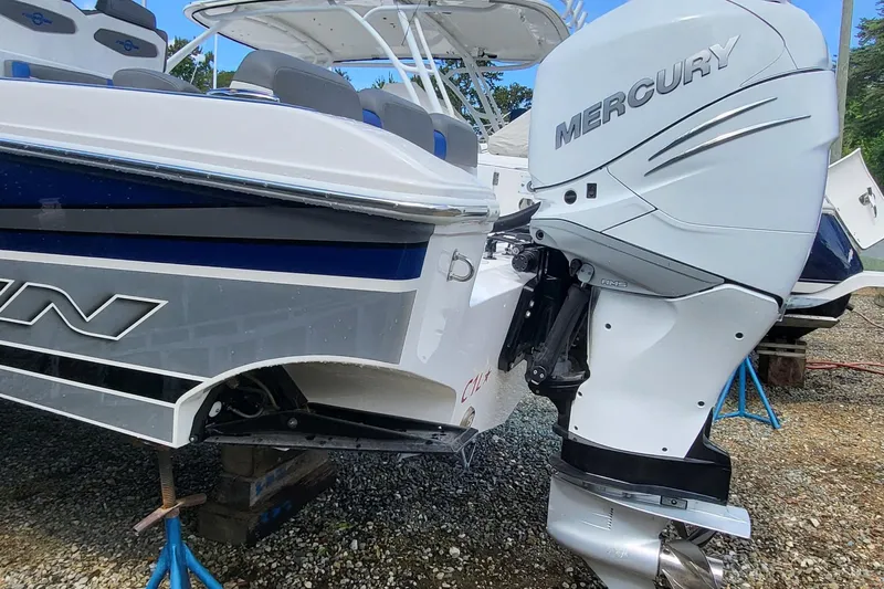  Yacht Photos Pics 2022 Fountain 34 SC boat with Mercury outboard engine on display.