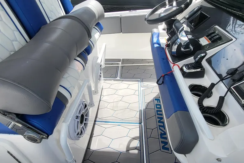  Yacht Photos Pics 2022 Fountain 34 SC boat interior with modern controls and seating.