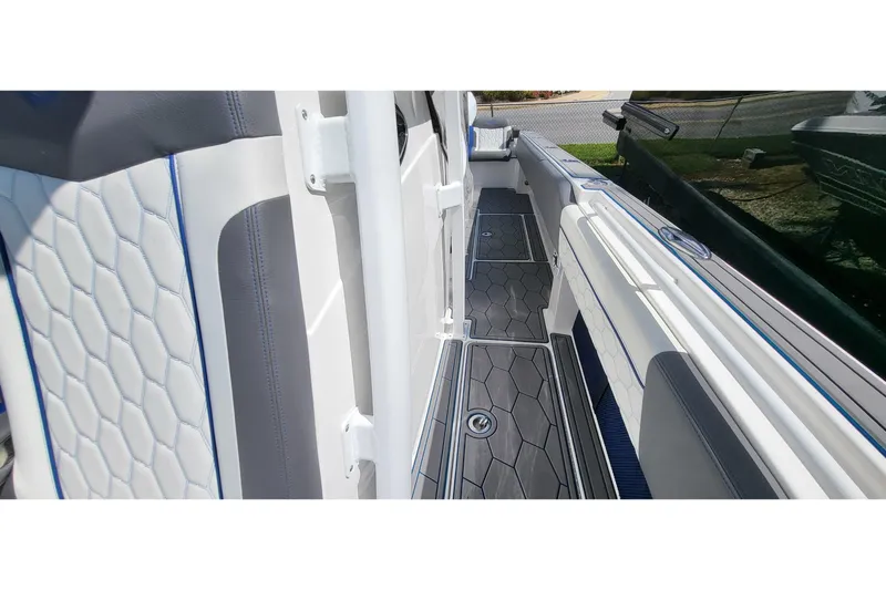 Yacht Photos Pics 2022 Fountain 34 SC boat interior with sleek, modern design and hexagonal pattern upholstery.