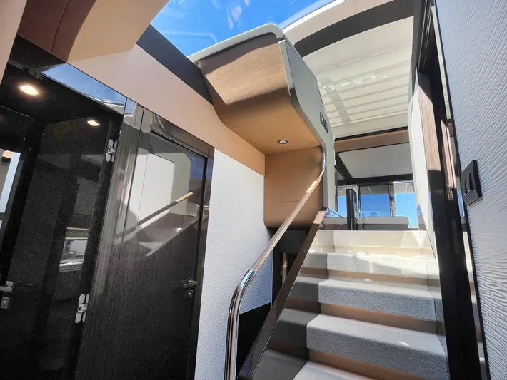  Yacht Photos Pics Interior view of 2016 Azimut 77S yacht, featuring modern staircase and sleek design.
