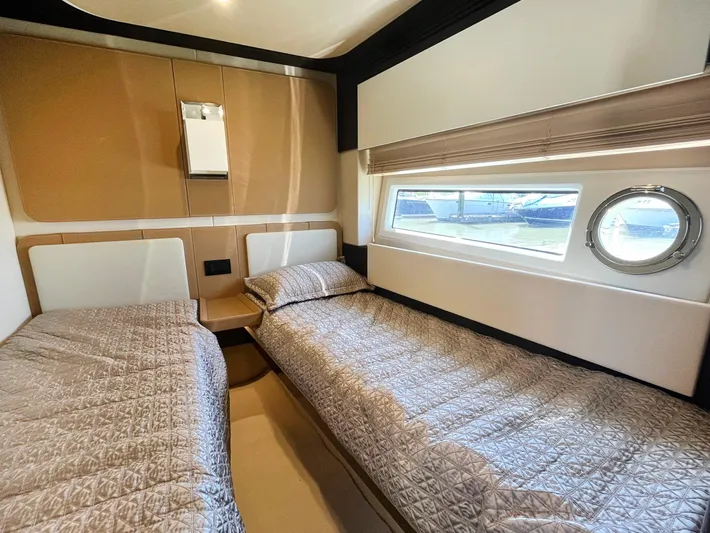  Yacht Photos Pics Luxurious twin cabin interior of 2016 Azimut 77S yacht with modern design and window view.