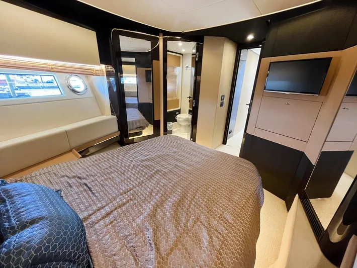  Yacht Photos Pics Luxurious bedroom interior of 2016 Azimut 77S yacht with modern design and elegant furnishings.