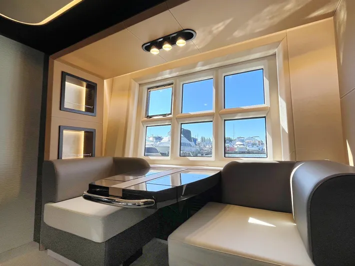  Yacht Photos Pics Luxurious interior of 2016 Azimut 77S yacht with modern seating and large windows.