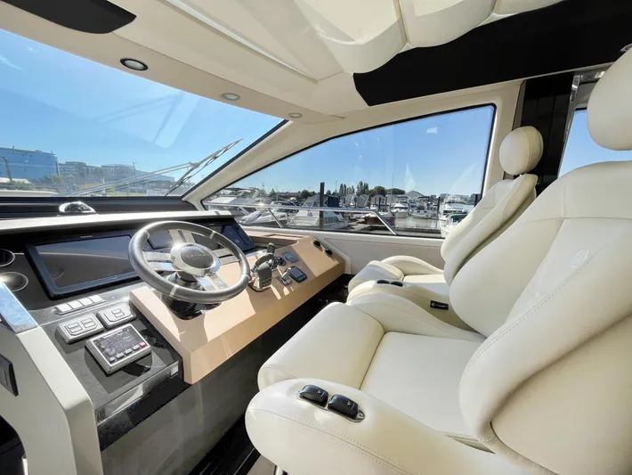  Yacht Photos Pics Luxurious interior of 2016 Azimut 77S yacht with modern helm and plush seating.