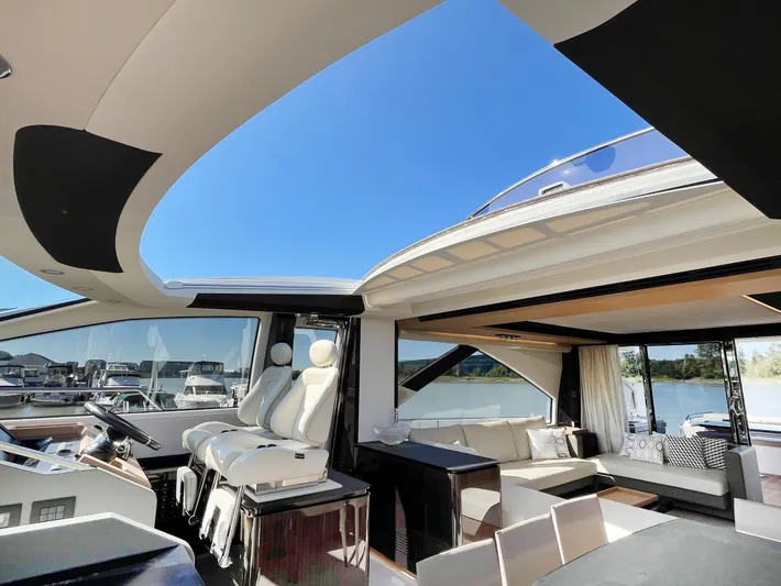  Yacht Photos Pics Luxurious interior of a 2016 Azimut 77S yacht with modern seating and panoramic views.