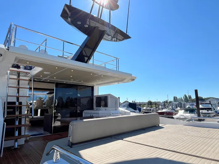  Yacht Photos Pics Luxurious 2016 Azimut 77S yacht with spacious deck and modern design in marina setting.