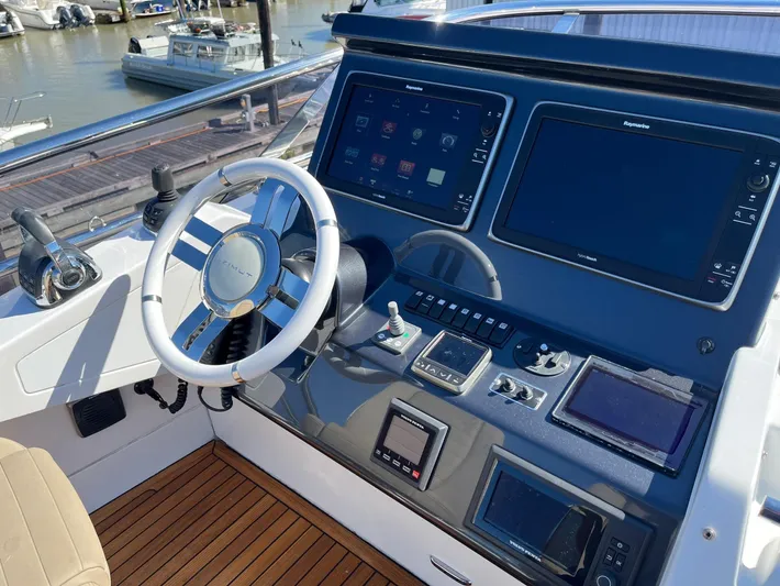  Yacht Photos Pics Helm of 2016 Azimut 77S yacht with modern navigation equipment and controls.